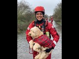Rescue person holding a dog